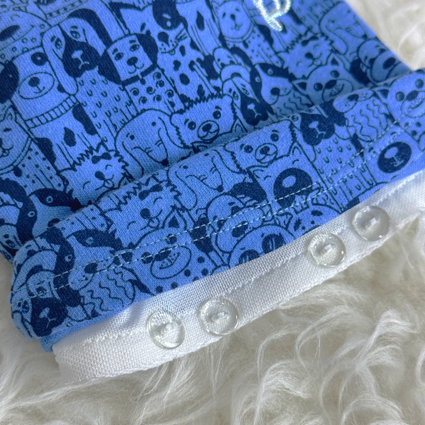 Button Seam of Blue Puppy Palooza Interchangeable Tee (Available in other Designs) to allow for easy interchangeability of pet clothes sold at Velymon SG